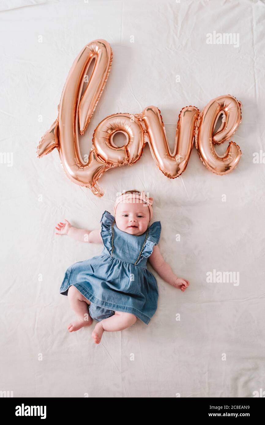 Cute Baby Girl Lying On Blanket Under Love Balloon At Home Stock Photo Alamy Cute Baby Girl Lying On Blanket Under Love Balloon At Home Stock Photo Alamy