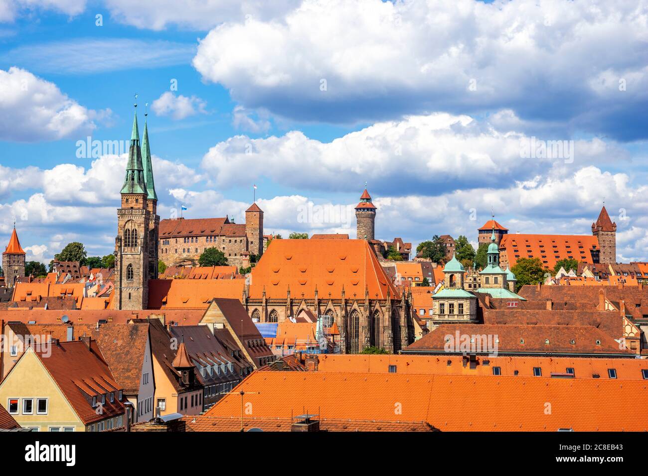 Germany, Bavaria, Nuremberg, Clouds over old town buildings surrounding Nuremberg Castle Stock Photo