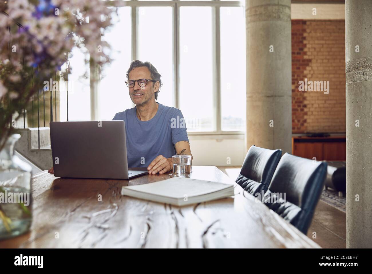 Man using computer in loft hi-res stock photography and images - Alamy