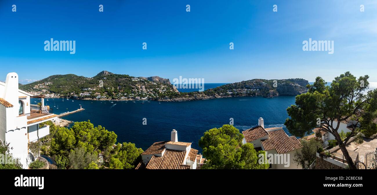 Spain, Mallorca, Andratx, Clear sky over bay of coastal town in summer Stock Photo