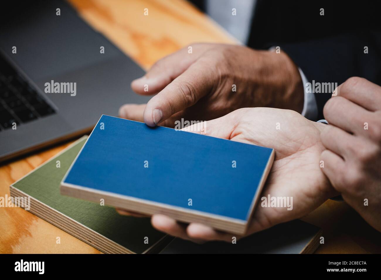 Hands of architects choosing colour samples in office Stock Photo