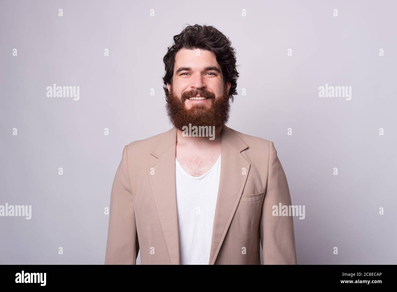 Simple front portrait of a bearded man over white background like for