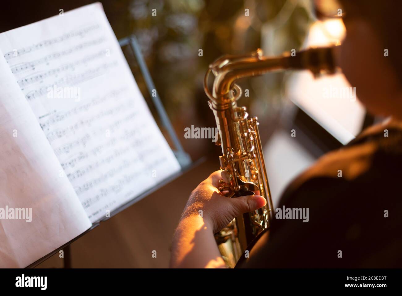 Boy practicing saxophone hi-res stock photography and images - Alamy