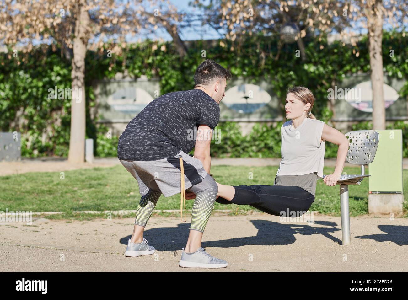 Woman during work out with coach in park Stock Photo