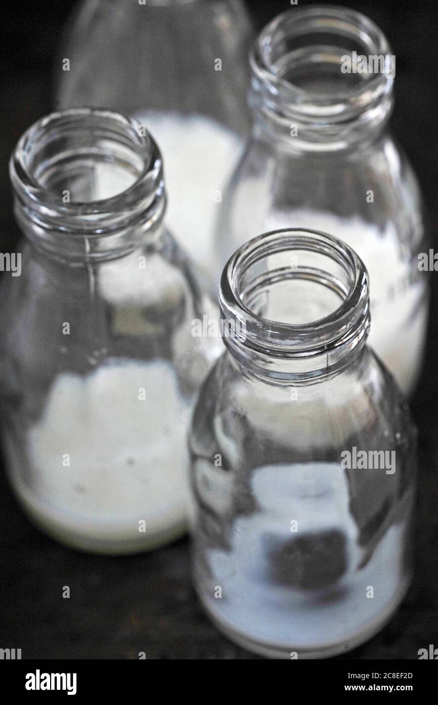 four used glass school milk bottles Stock Photo