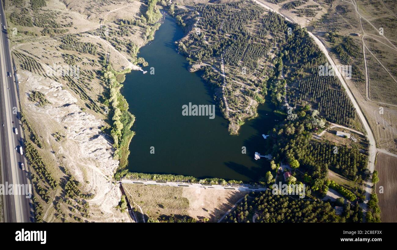 Aerial view of lake in nature and trees Stock Photo