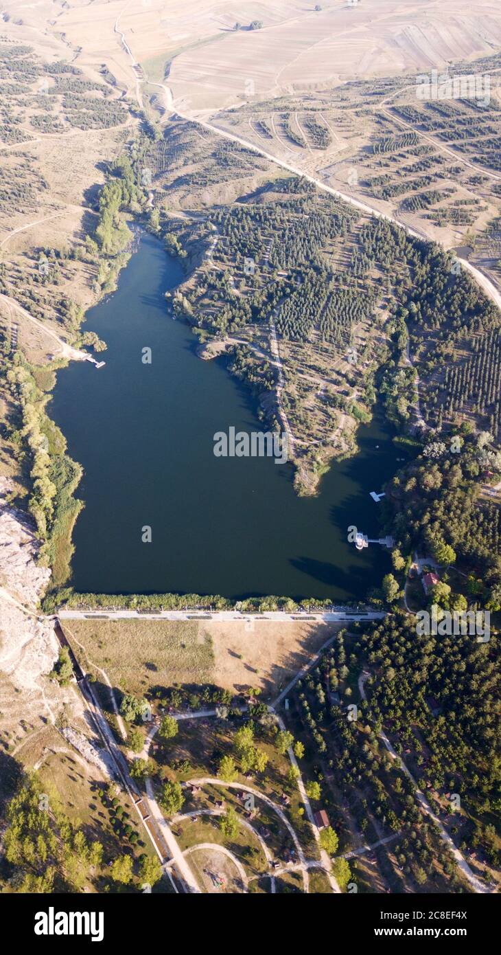 Aerial view of lake in nature and trees Stock Photo