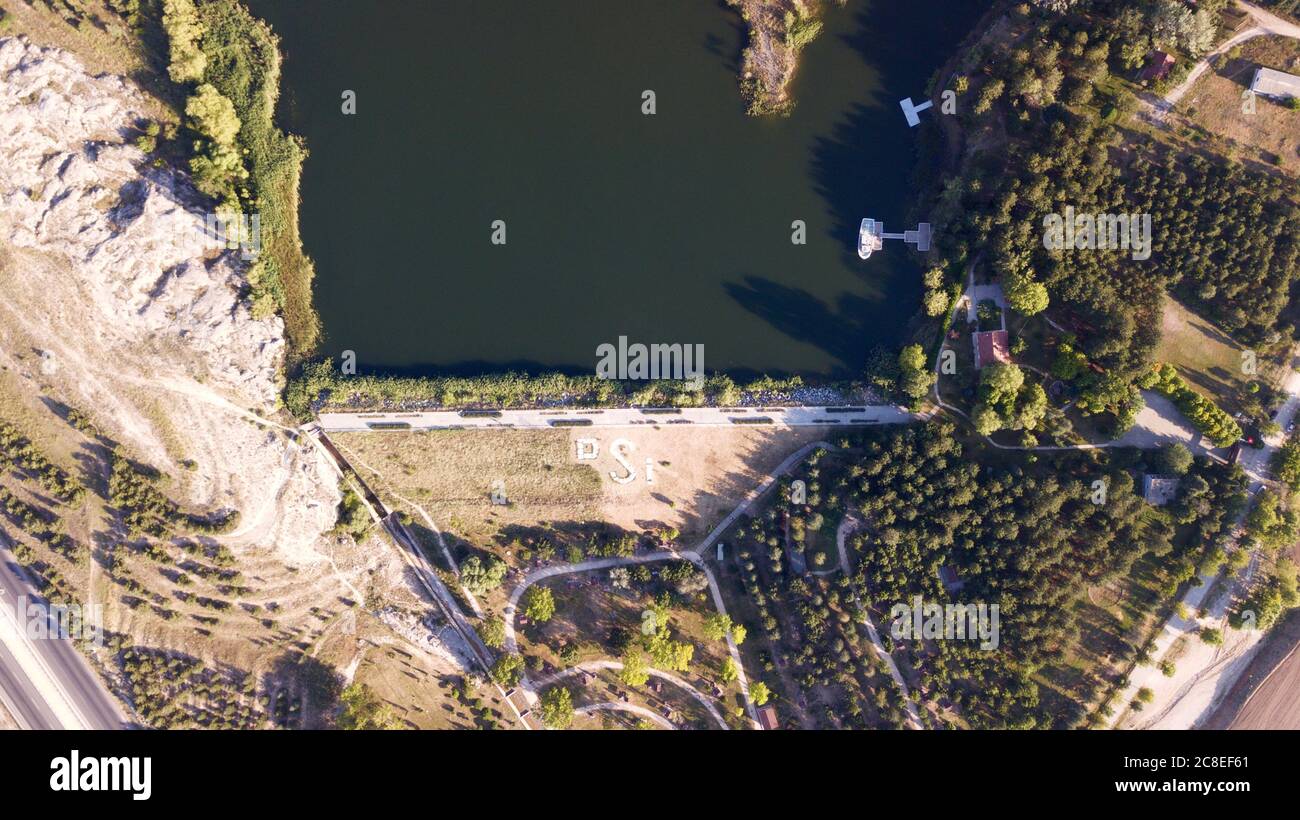 Aerial view of lake in nature and trees Stock Photo