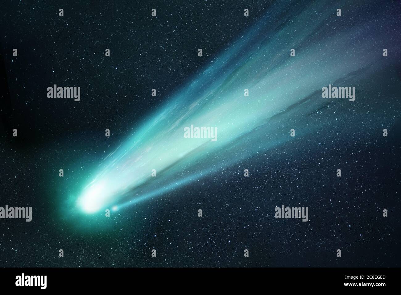 Comet Neowise passing the sun and releasing gases creating a tail and coma. Illustration. Stock Photo