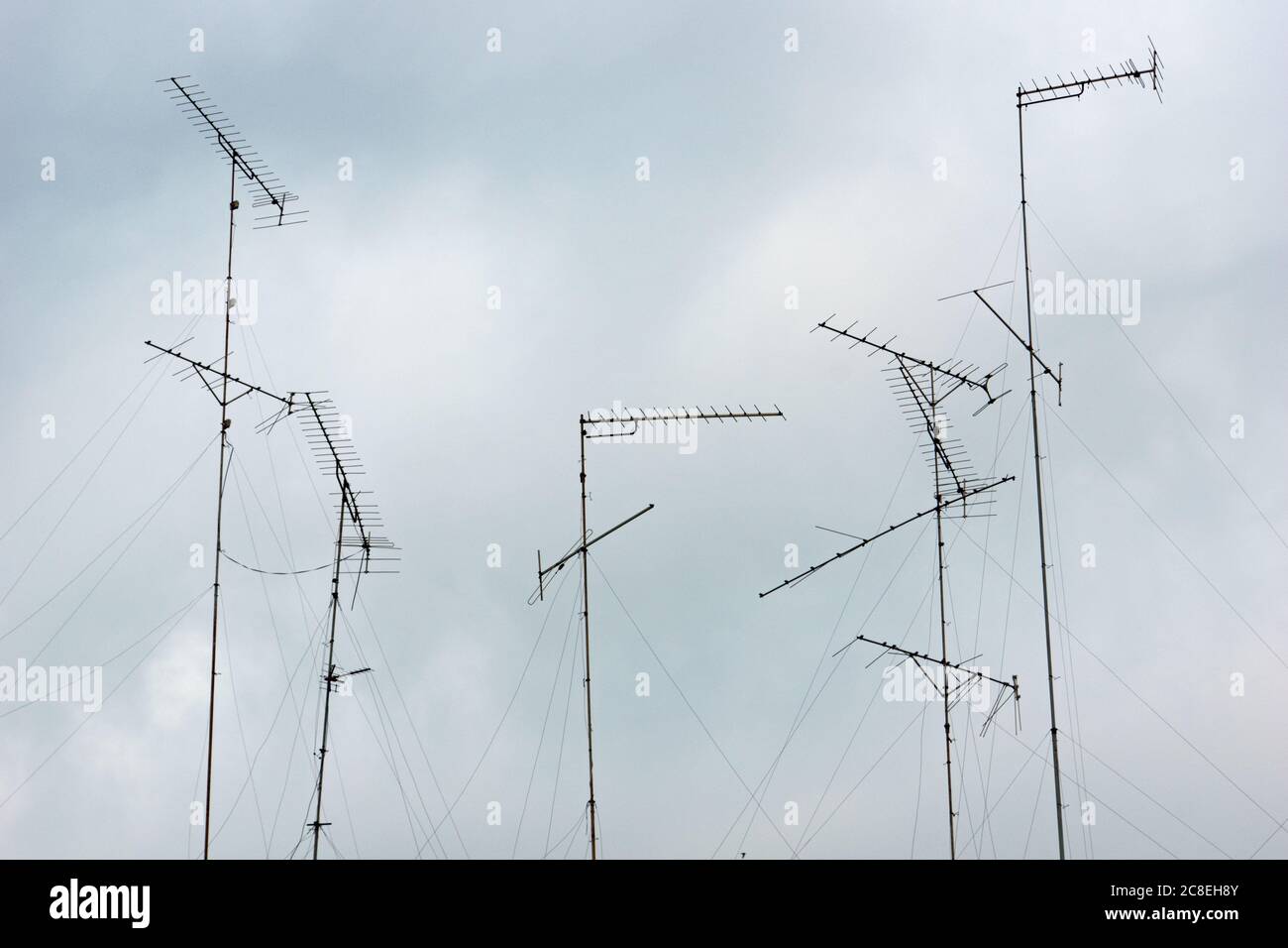 Television aerials and antenna array on roof of homes near Ratchaburi ...