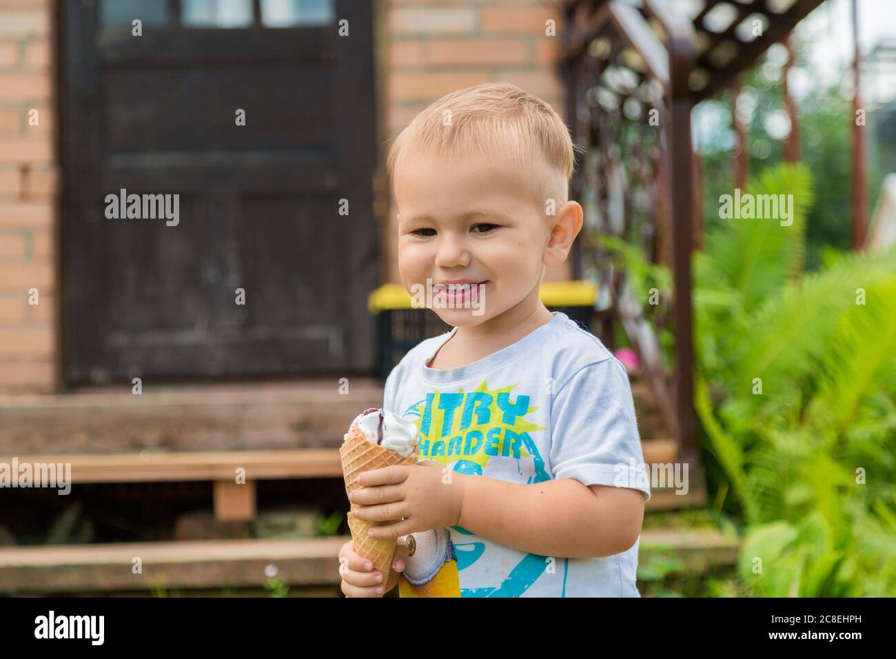 Balashiha, Russia 20 july 2020, Little boy having fun eating ice