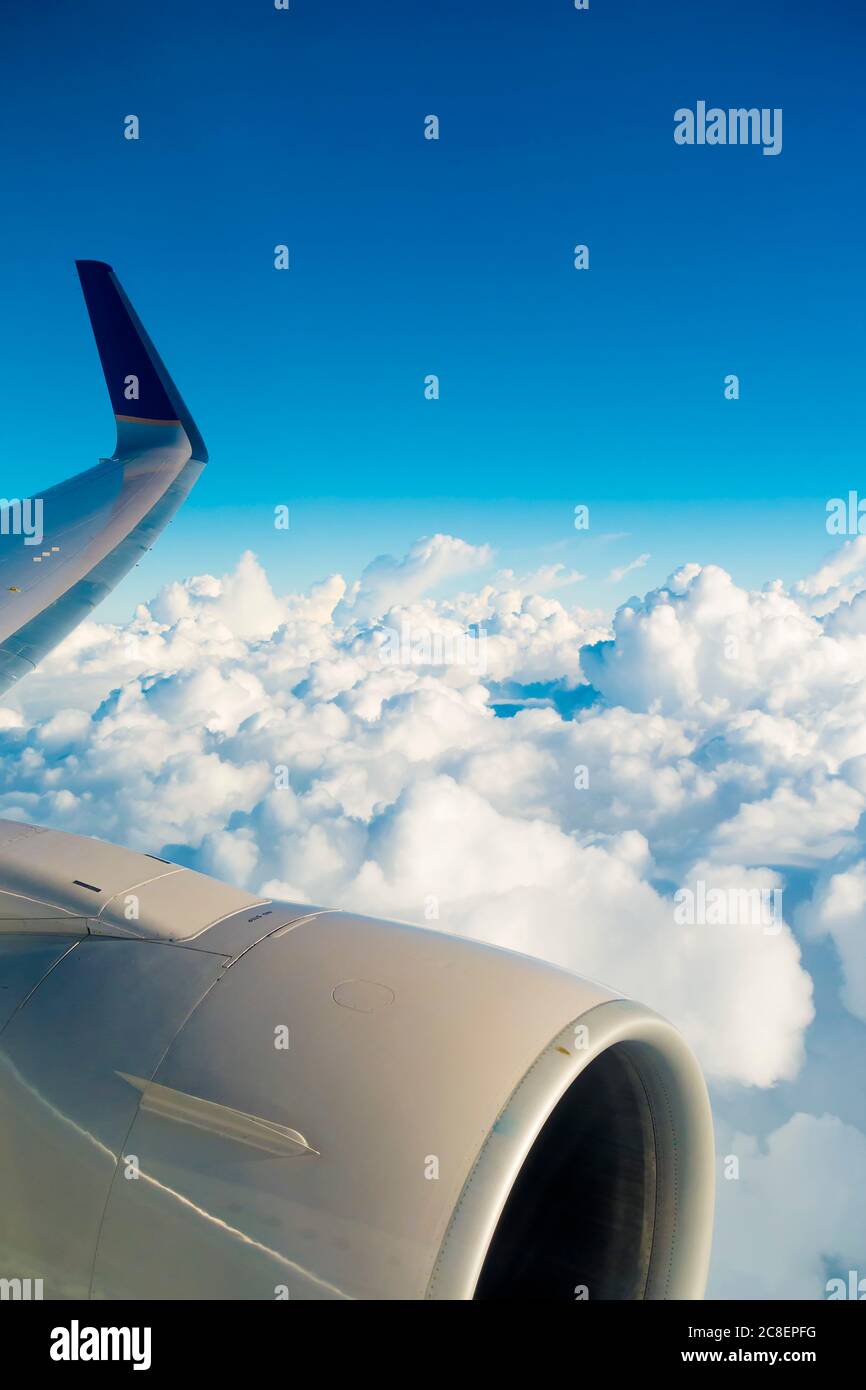 Aircraft engine wing blue sky clouds with copy space Stock Photo
