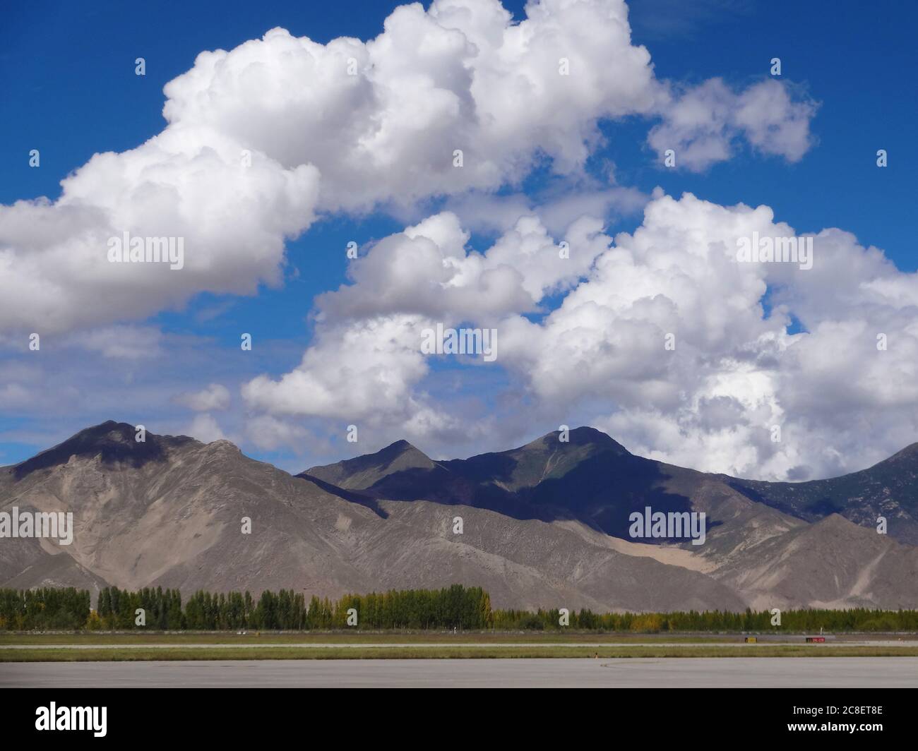 White clouds shadows on the mountain in Tibet Stock Photo