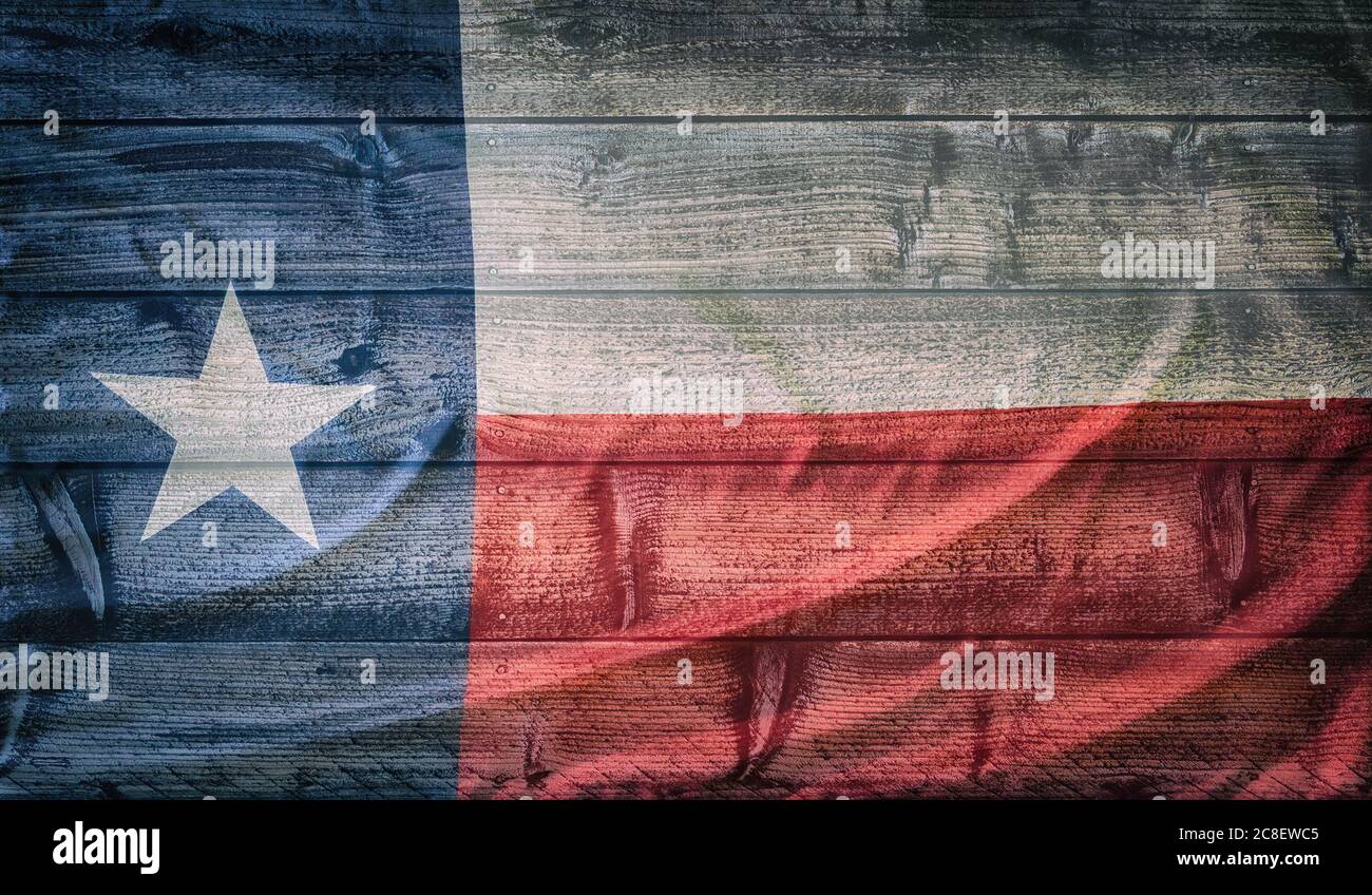 Texas state flag pattern on wooden board texture. Vintage style weathered background. Stock Photo