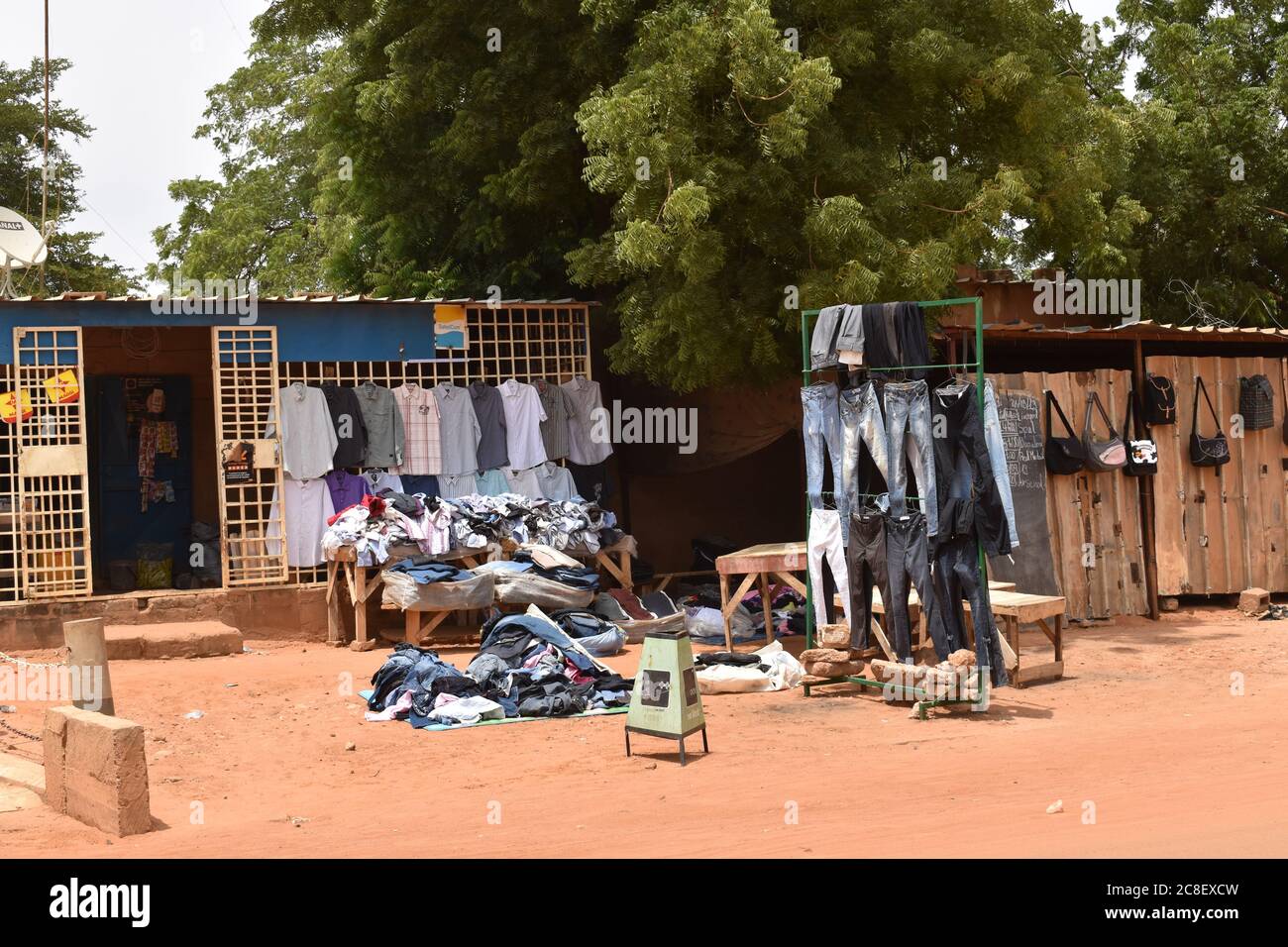 An outdoor display of a used clothing shop in Niamey, Niger, Africa Stock Photo