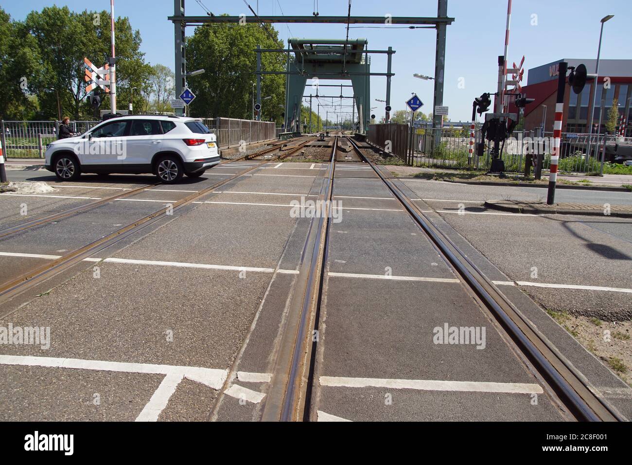 Level Crossing With A Railway Bridge In The Distance In The Dutch City Of Alkmaar A Passing Car Netherlands May Stock Photo Alamy Level Crossing With A Railway Bridge In The Distance In The Dutch City Of Alkmaar A Passing Car Netherlands May Stock Photo Alamy