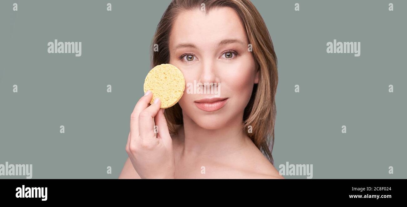Young beauty girl remove mascara. Face sponge cleaner Stock Photo Alamy