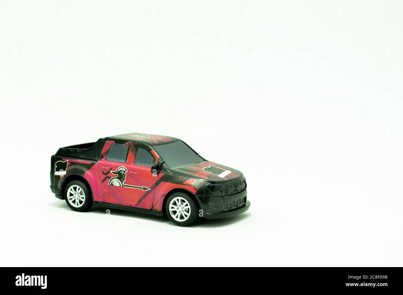 Red and black  Plastic Toy Car Isolated on White Background Stock Photo