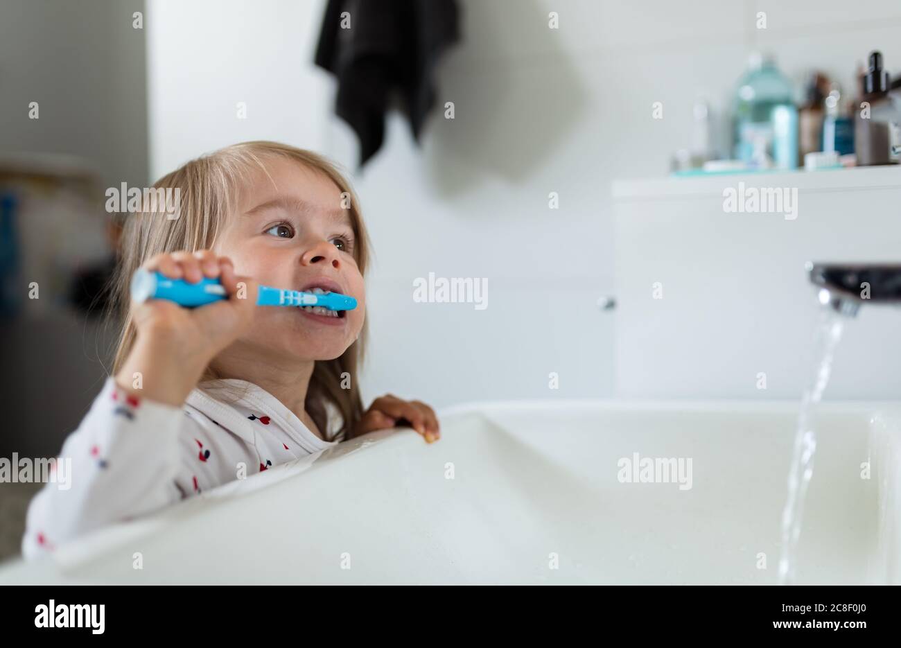 Child brushing teeth sink water hires stock photography and images Alamy