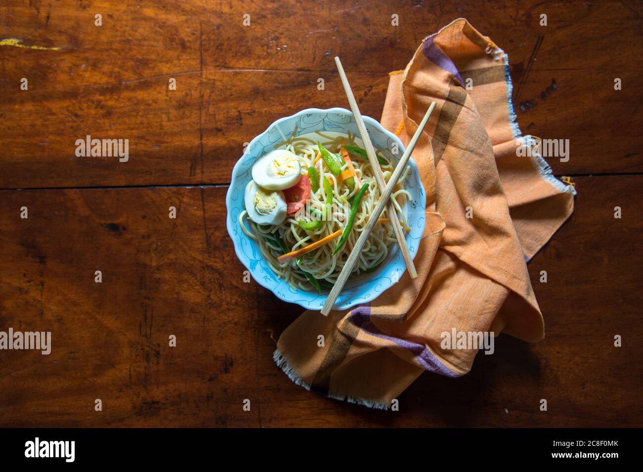 Chinese food in a bowl on a wooden background Stock Photo