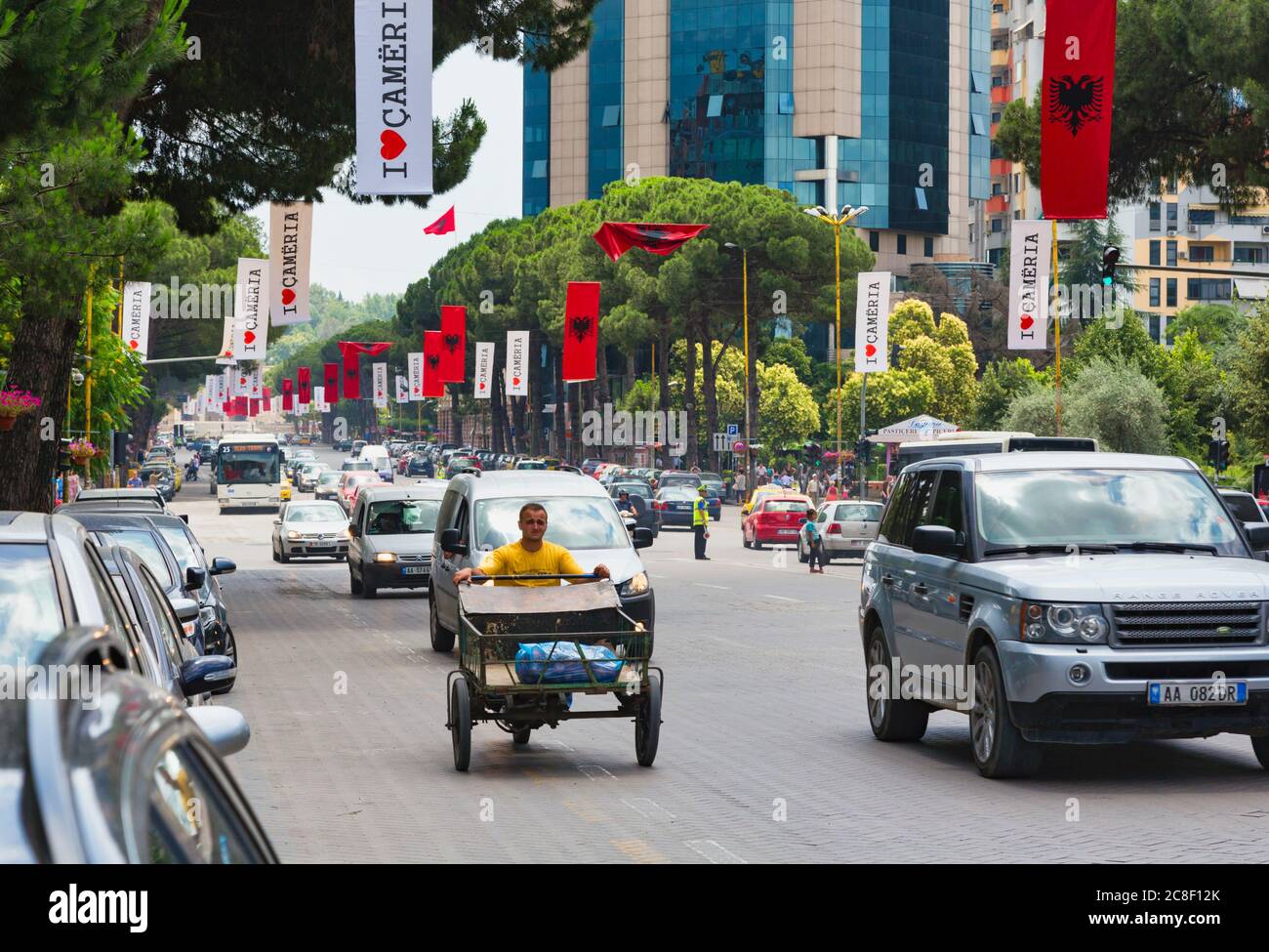 Tirana, Albania. Traffic on Dëshmorët e Kombit Boulevard or Martyrs of the Nation Boulevard, one of the capital's main thoroughfares. Stock Photo