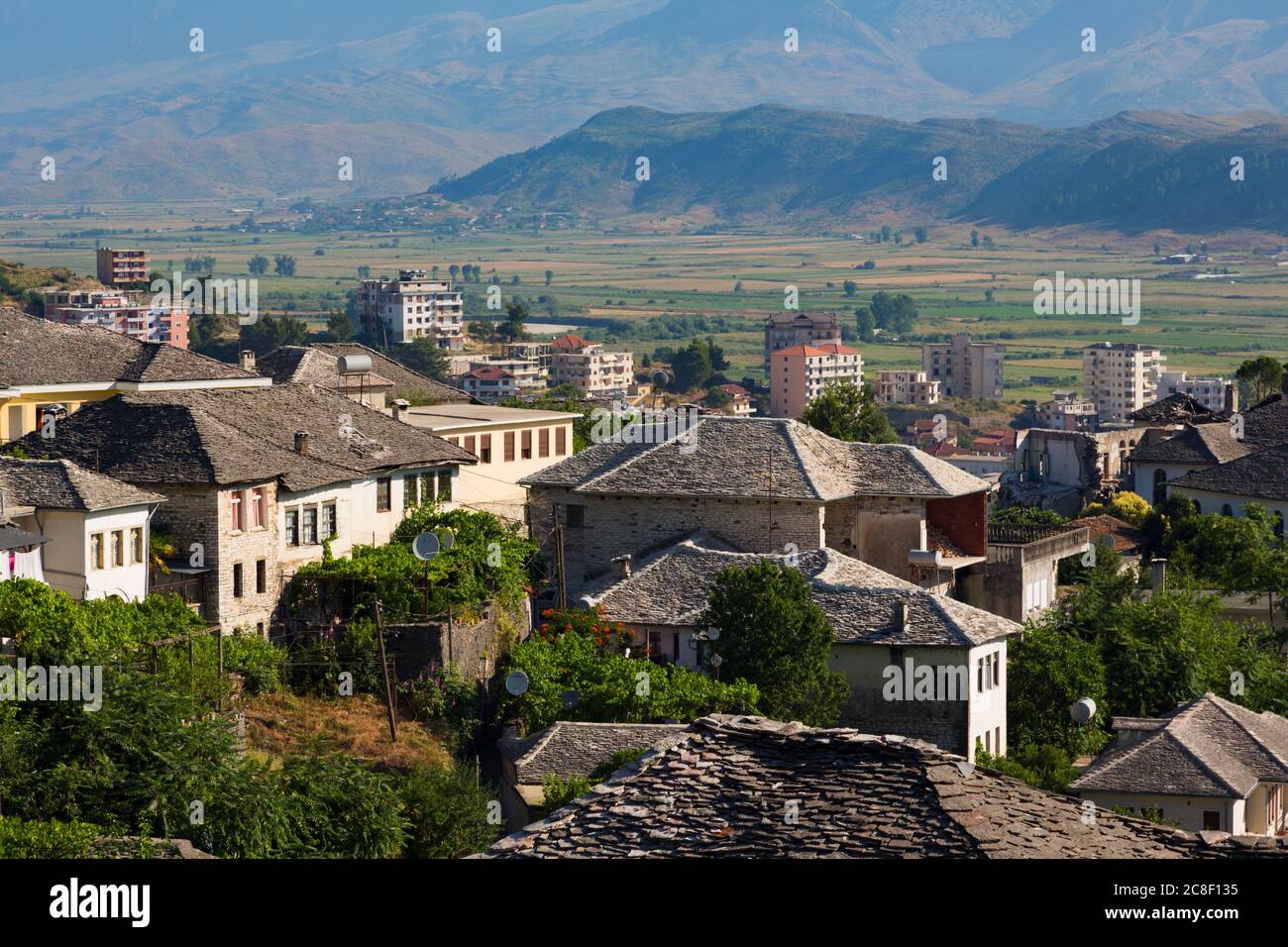 Gjirokastra or Gjirokaster, Albania.  Typical architecture in the old town.  Houses with stone roofs. Gjirokastra is a UNESCO World Heritage Site. Stock Photo