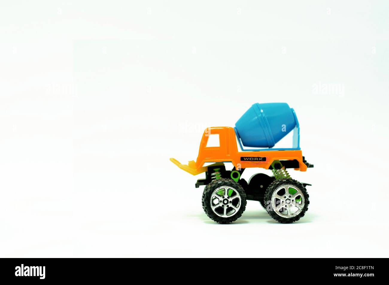 colorful truck cement (concrete) mixer plastic toy isolated on white background Stock Photo