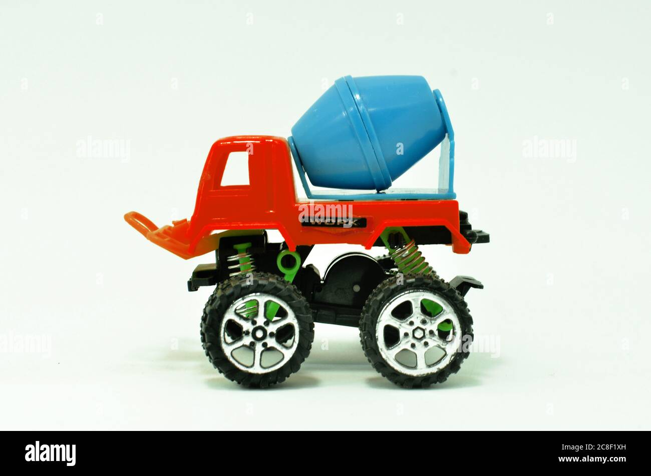 colorful truck cement (concrete) mixer plastic toy isolated on white background Stock Photo