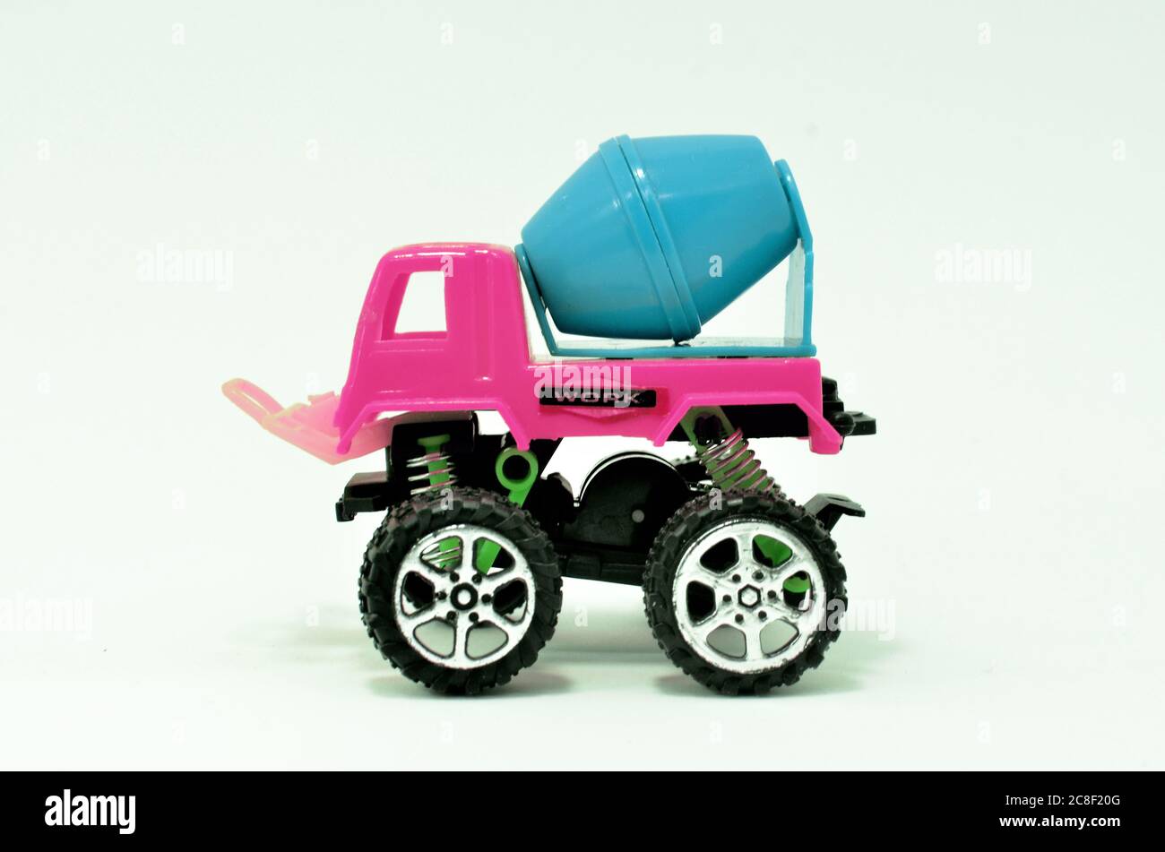 colorful truck cement (concrete) mixer plastic toy isolated on white background Stock Photo