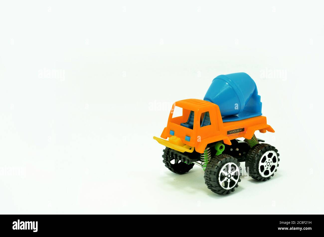 colorful truck cement (concrete) mixer plastic toy isolated on white background Stock Photo