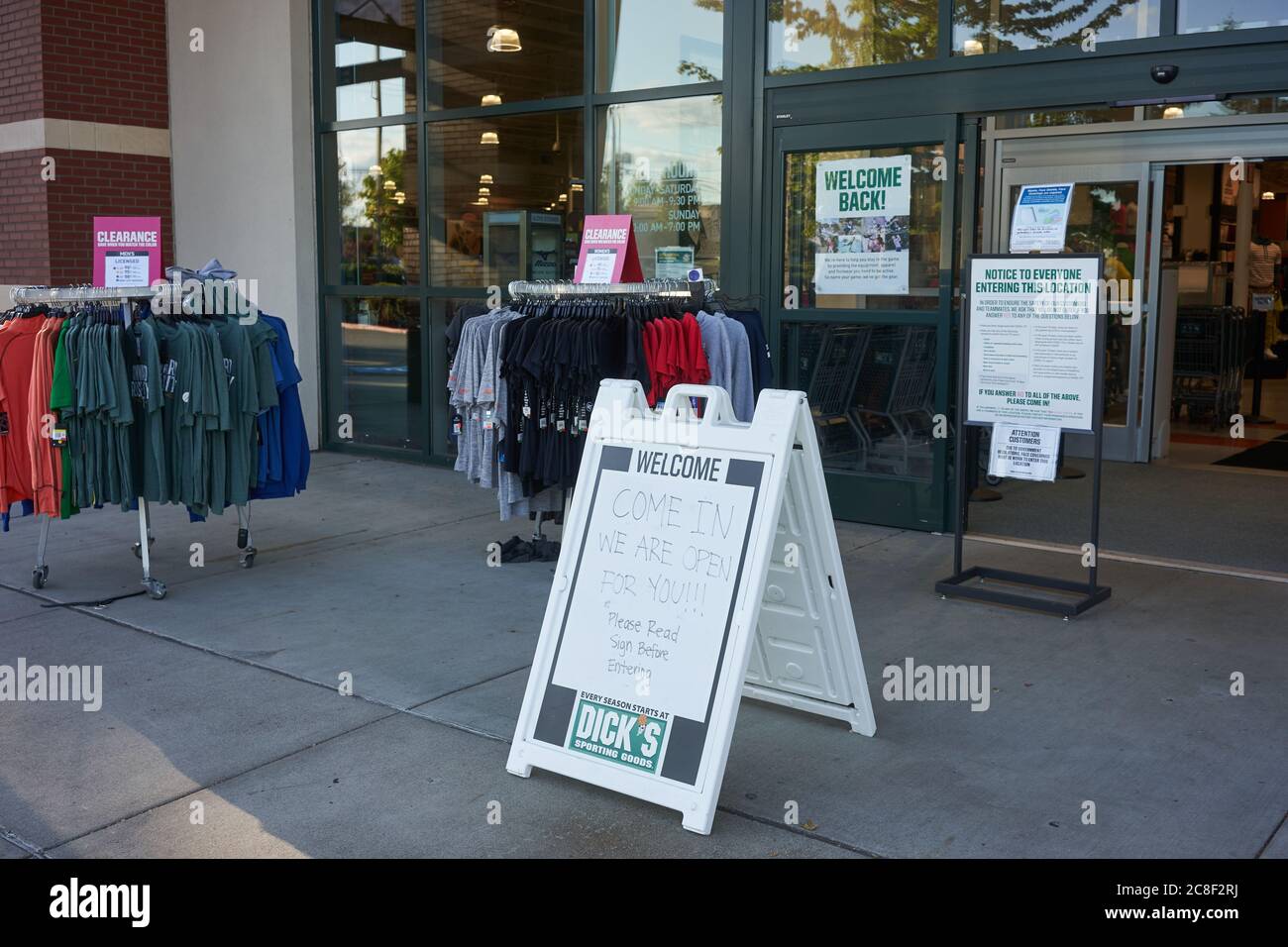 Signs clarifying safety protocols are seen at the entrance to a reopened Dick's Sporting Goods store in Lake Oswego, Oregon, on Thurs., July 22, 2020. Stock Photo