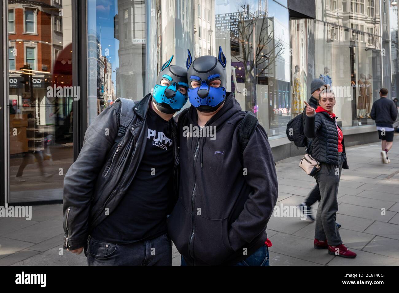 London - England - 21032020 - Couple wearing dog style facemasks during the Covid-19 restrictions in London - Photographer : Brian Duffy Stock Photo