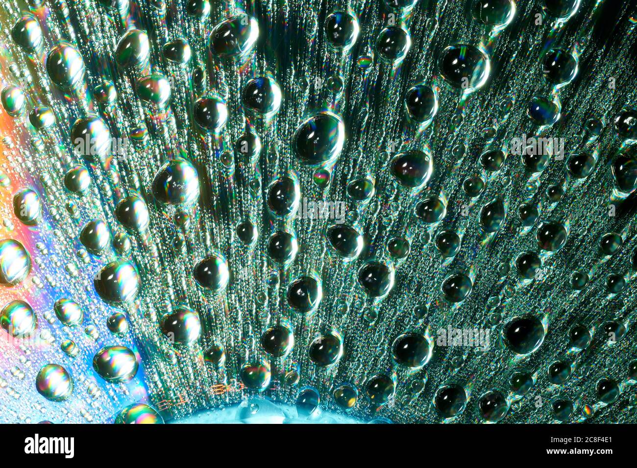 Macro of water drops on multicolor background Stock Photo - Alamy