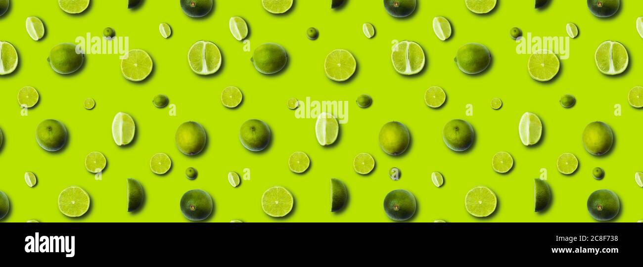 fresh slices lime on a light green background Stock Photo