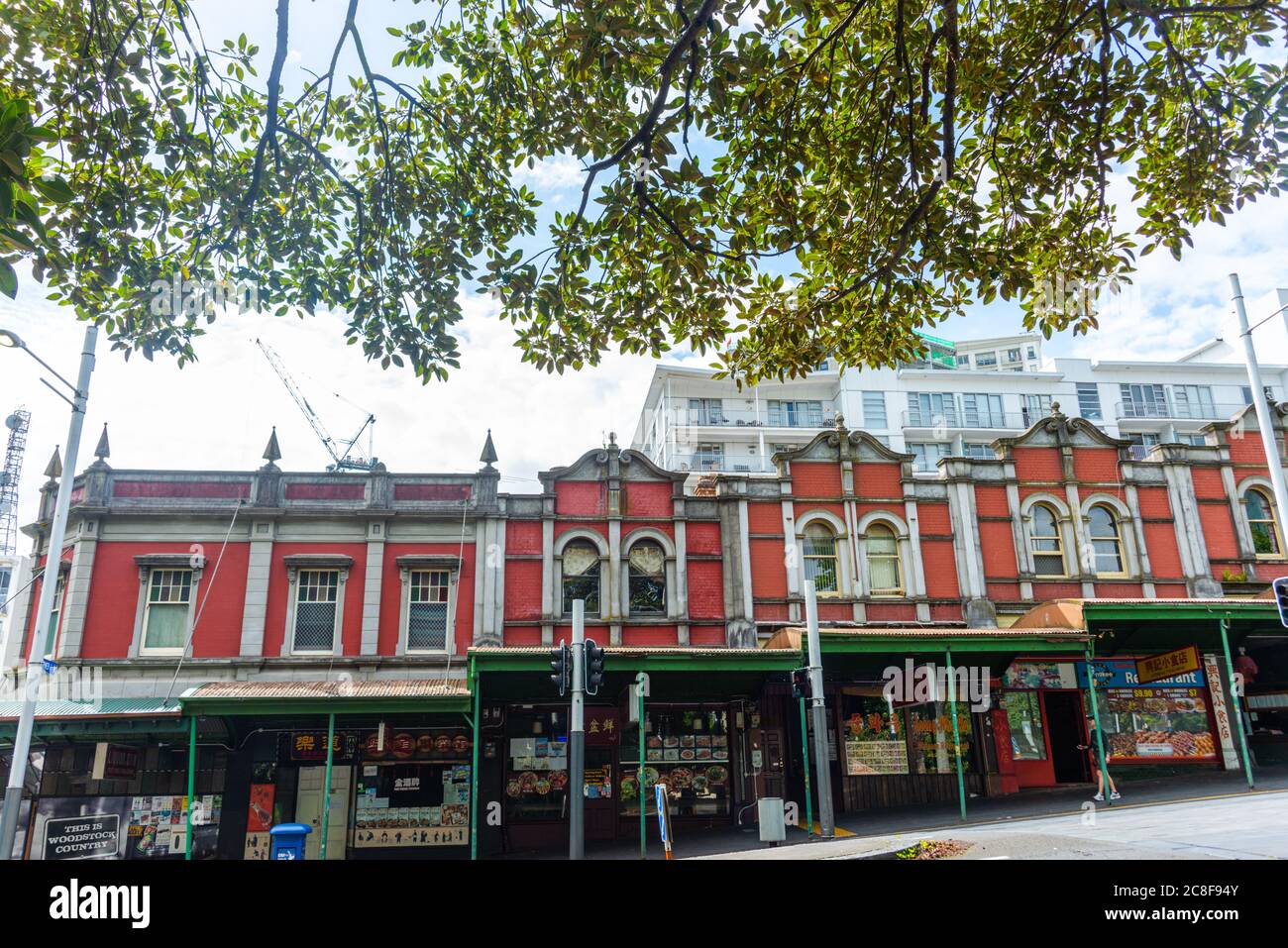 row of red brick shops on Queen Street, Auckland Stock Photo Alamy
