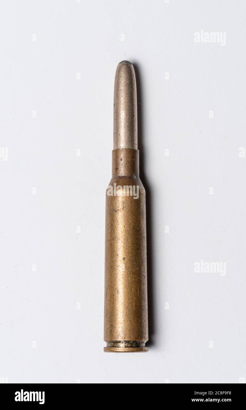 Old rifle bullet from the 1950s on white background Stock Photo
