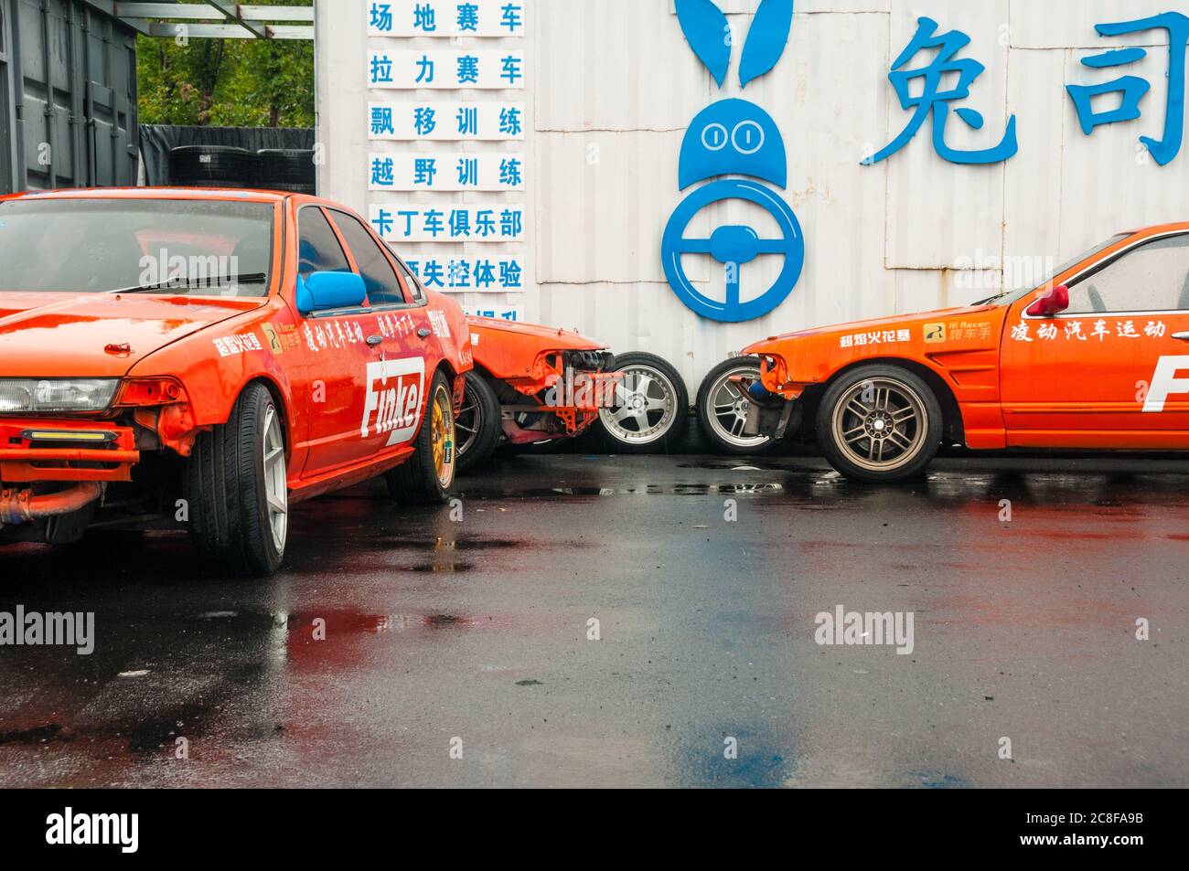 A trio of Nissan Laurel Altima drift cars at the Rabbit Driver school around Duxingcun in Pudong, Shanghai. Stock Photo