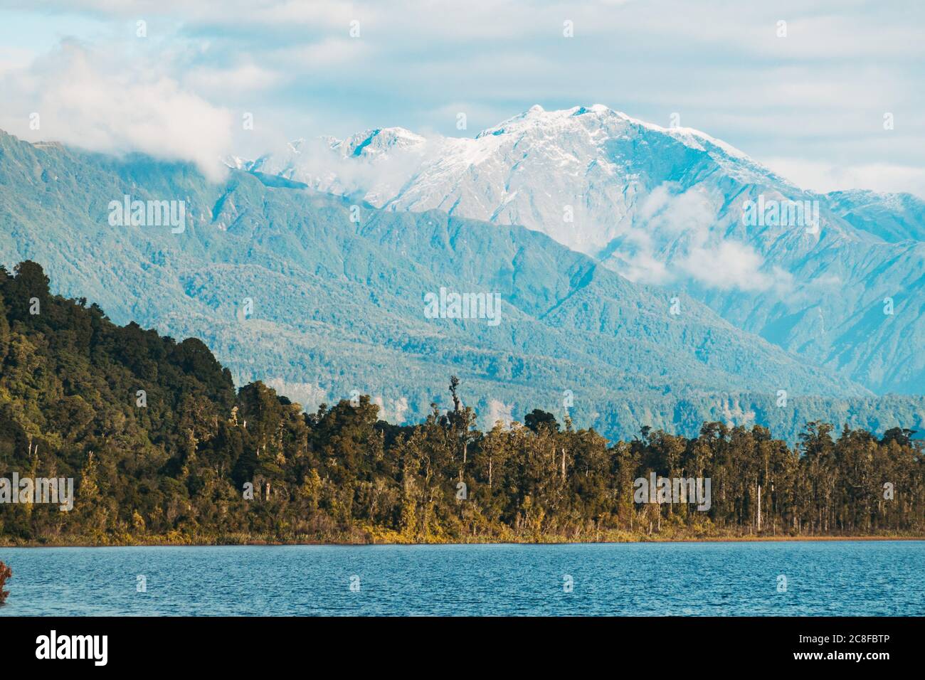Mountains and forest at Lake Ianthe / Matahi on the southern West Coast of New Zealand Stock Photo