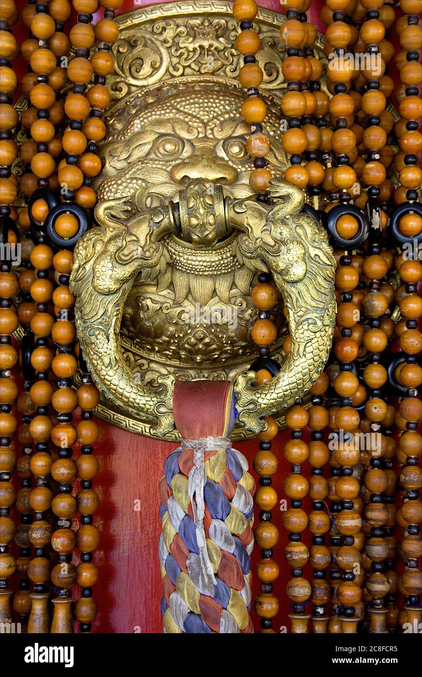 Closer view of beautifully designed metallic door handle at Namdroling Monastery (Golden Temple), Bylakuppe, near Kushalnagar, Mysore District, Karnat Stock Photo