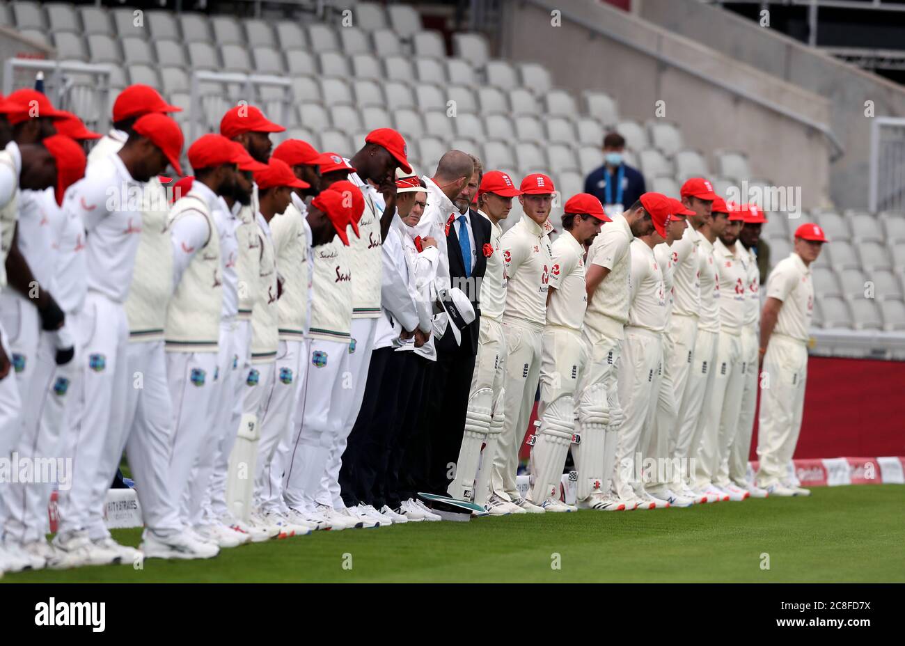 England and West Indies wear red caps 
