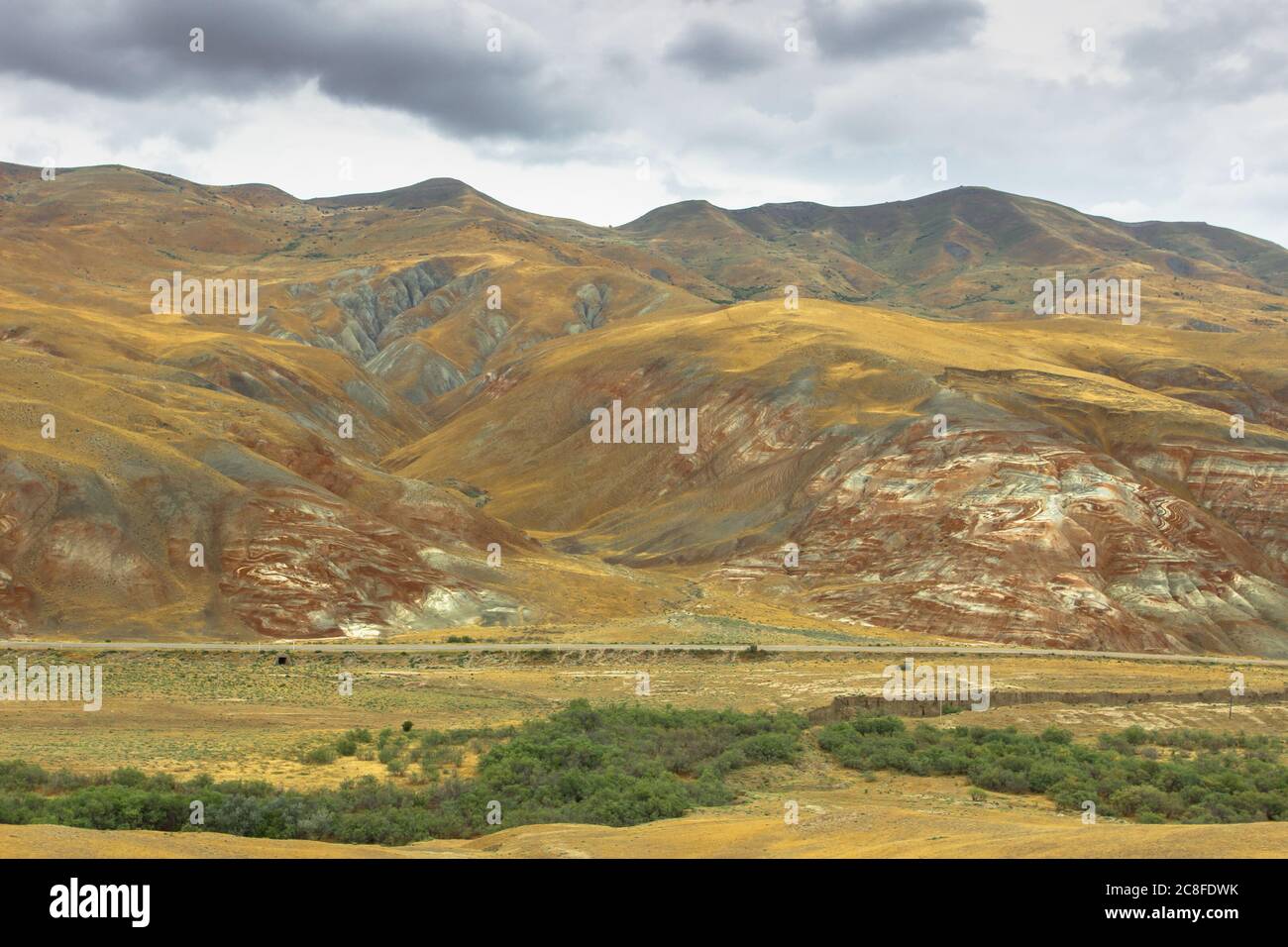 Cross-bedding in Candy Cane Mountains in Azerbaijan. Colorful stripes of the hills. Shale striped mountains. Red-pink and white striped area of Stock Photo