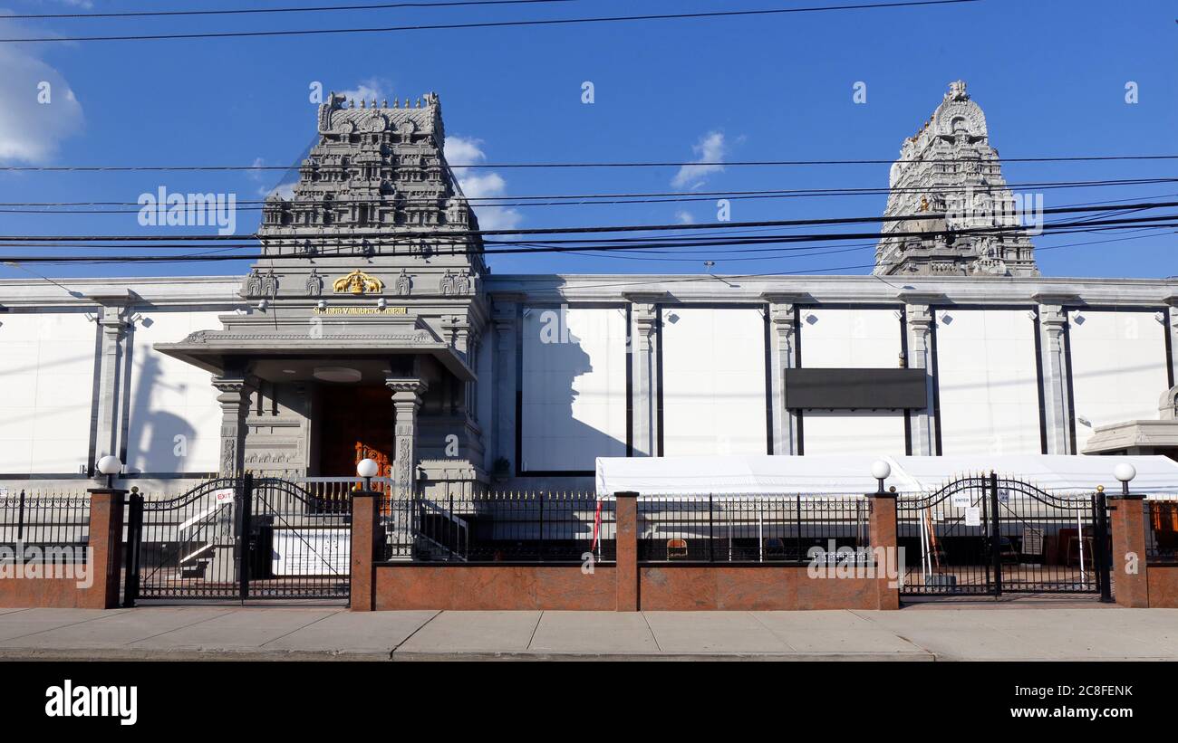 The Hindu Temple Society of North America, 45-57 Bowne St, Flushing, NY. exterior of a Ganesh temple with ornate Gopuram entrances into the complex Stock Photo