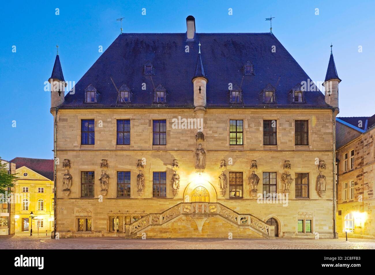 place of the signing of Peace of Westphalia, historic town hall of Osnabrueck in the evening, Germany, Lower Saxony, Osnabrueck Stock Photo