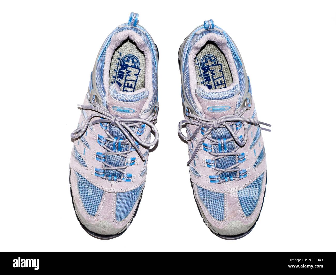 Top down view of a pair of Meindl lace-up fabric and leather walking shoes isolated on a white background from above. German manufacturer Stock Photo