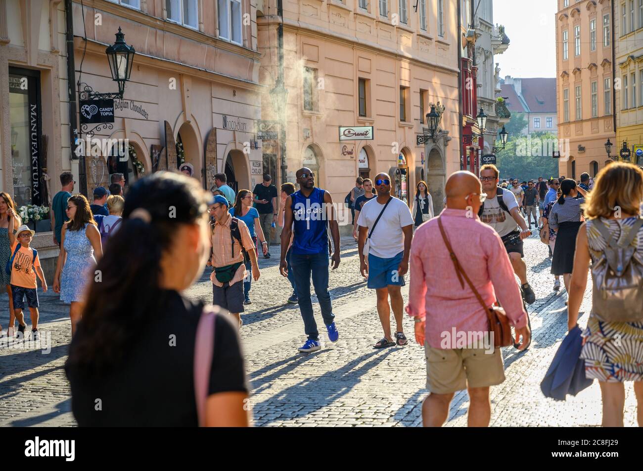 PRAGUE - JULY 20, 2019: Tourists exploring the ancient cobbled streets in  old town district of Prague, Czech Republic in the golden light of early  eve Stock Photo - Alamy