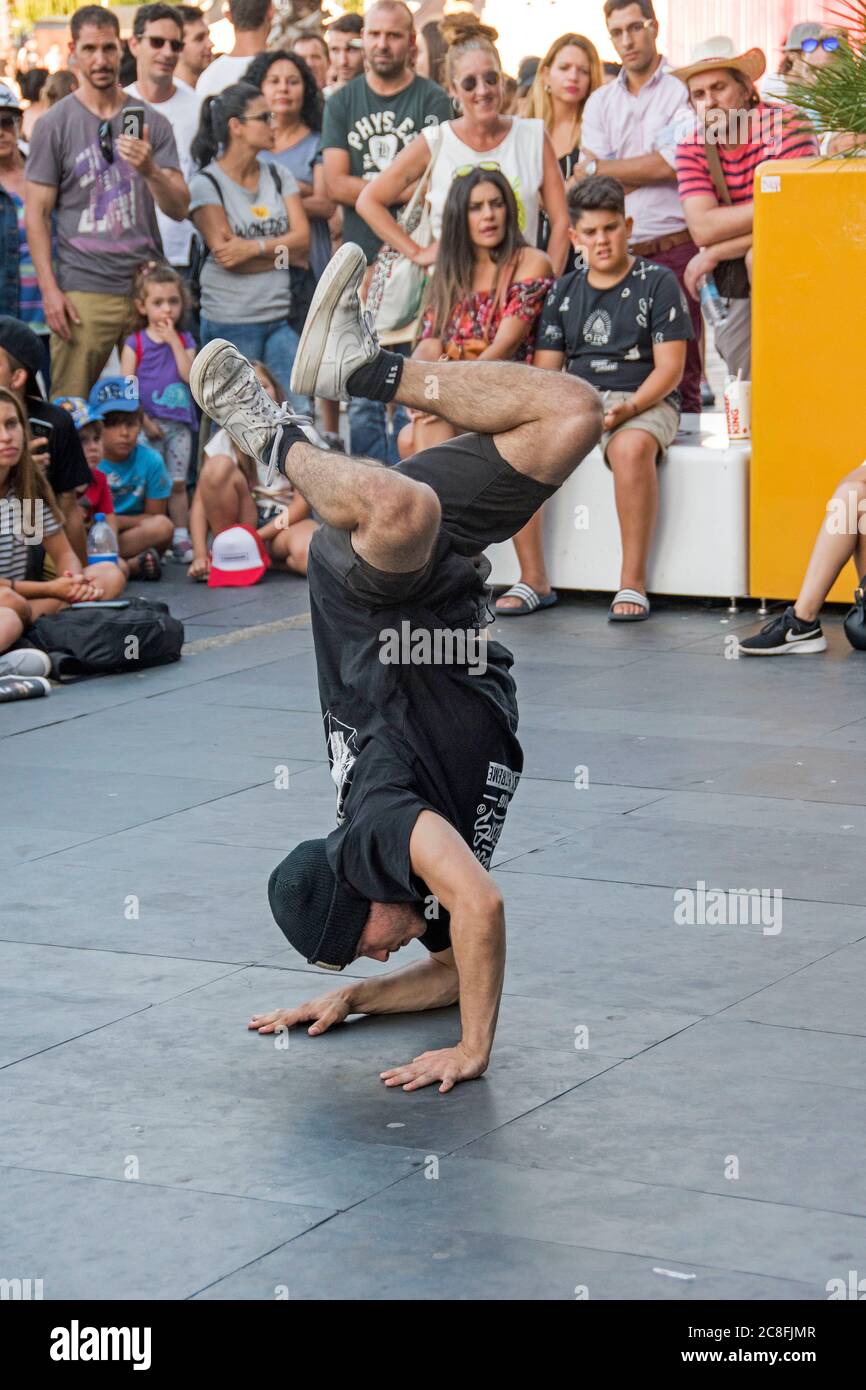 Street dancer performing during action sports festival in Vigo in the province of Pontevedra (Spain), part of the autonomous community of Galicia. Stock Photo