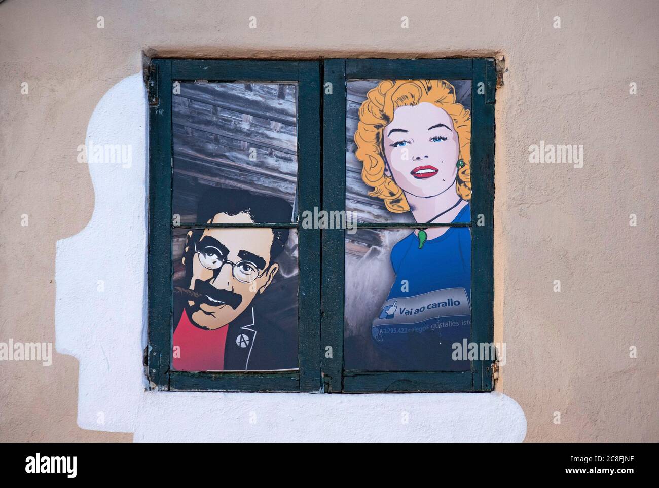 Groucho Marx and Marilyn Monroe artwork in a house window at Vigo in the province of Pontevedra (Spain), part of the autonomous community of Galicia. Stock Photo