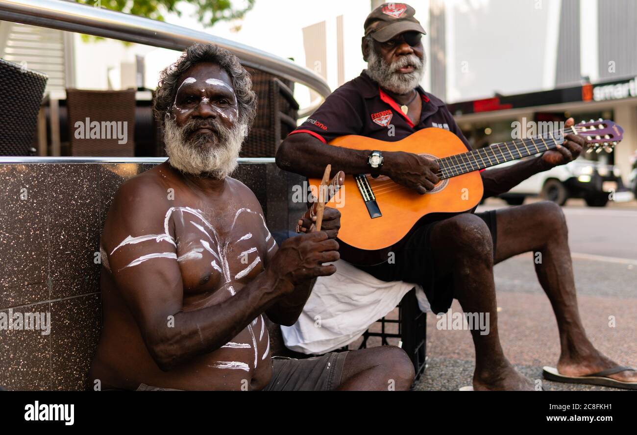 ABORIGINAL PEOPLE PLAYING MUSIC IN THE STREET OF DARWIN AUSTRALIA; THE WHITE BODY PATING COME ABORIGINAL PEOPLE PLAYING MUSIC IN THE STREET OF DARWIN AUSTRALIA; THE WHITE BODY PATING COME