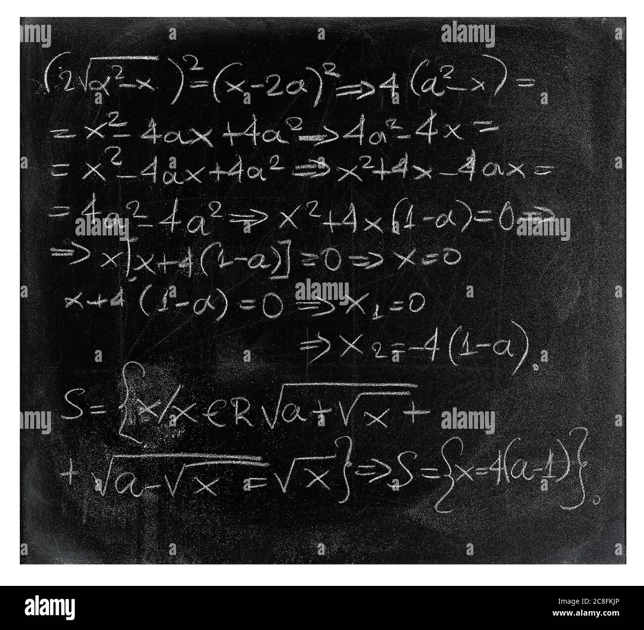 equation written with chalk on black chalkboard Stock Photo
