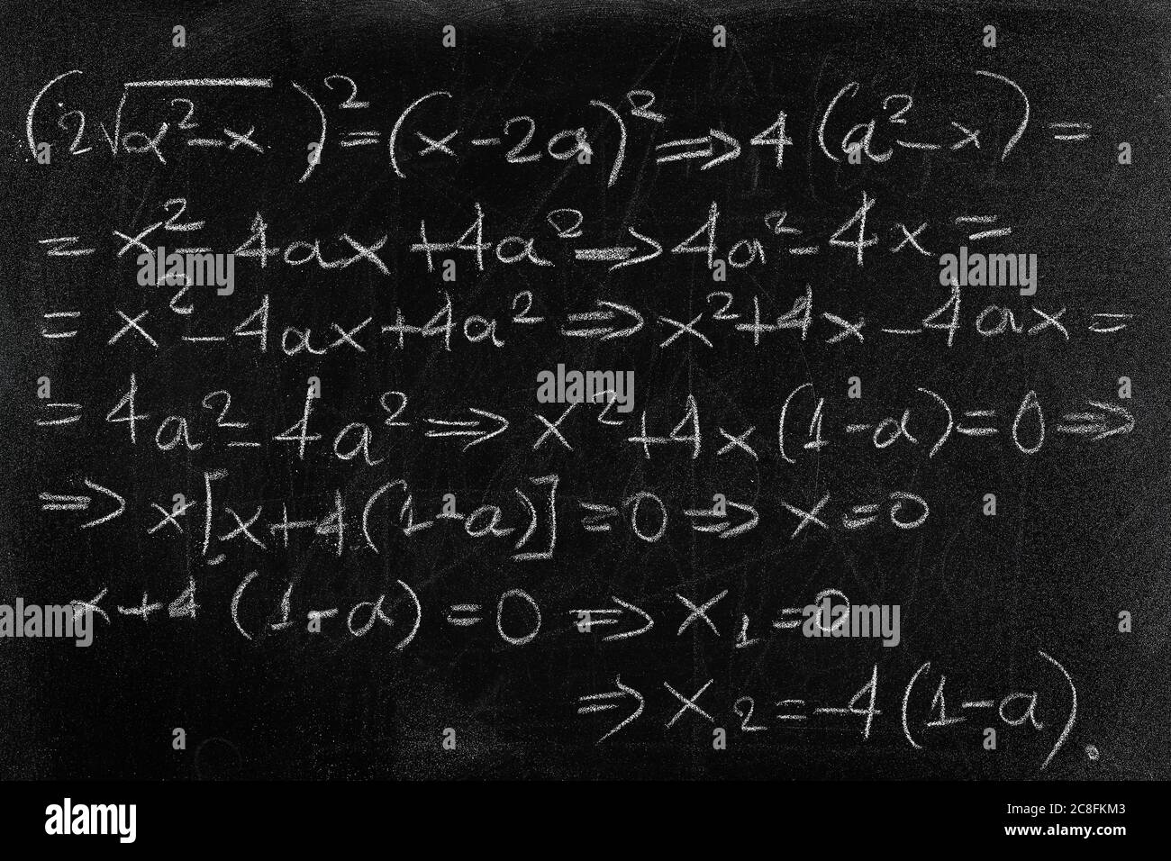 equation written with chalk on black chalkboard Stock Photo Alamy